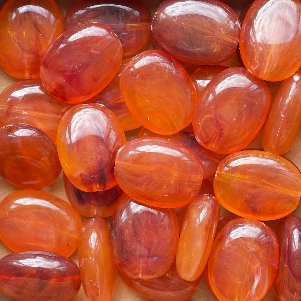 Oranje/bruin acryl kralen ovaal
