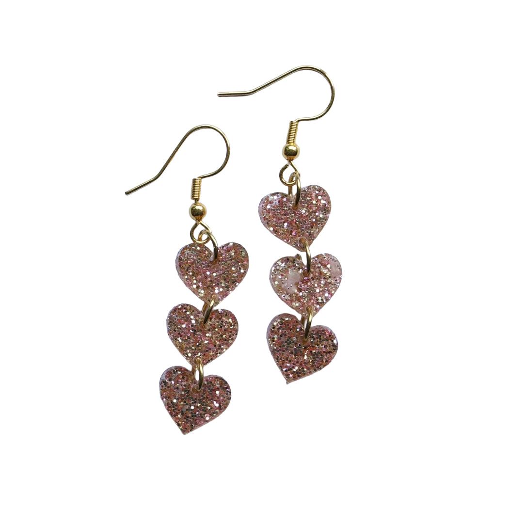 Triple hartjes oorbellen - glitter acryl - goudkleurig