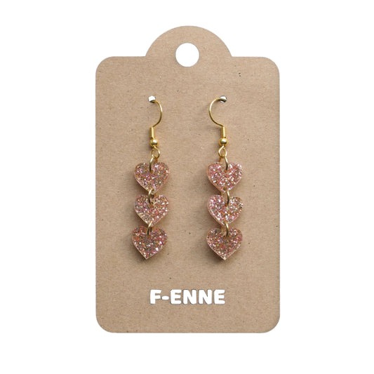 Triple hartjes oorbellen - glitter acryl - goudkleurig